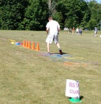 Lincolnville Central School P.E. teacher Nick DePatsy demonstrates the obstacle course. (Courtesy Jennifer Meservey Johnson)