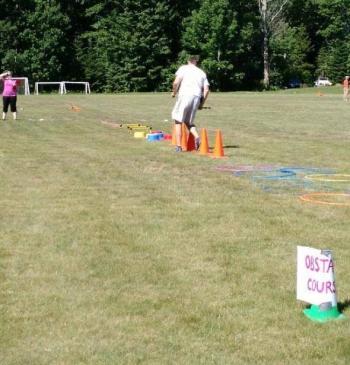 Lincolnville Central School P.E. teacher Nick DePatsy demonstrates the obstacle course. (Courtesy Jennifer Meservey Johnson)