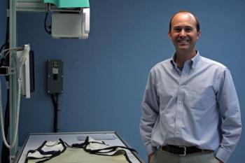 Dr. Bjorn Lee, veterinarian and owner of PenBay Veterinary Associates in Rockport, stands next to a new piece of X-ray equipment at the new Midcoast Animal Emergency Clinic on Route 90 in Warren. (Photo by Holly S. Edwards)