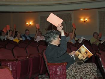 Camden voters raise their cards during the 2015 Town Meeting in the Camden Opera House June 10. (Photo by Holly S. Edwards)