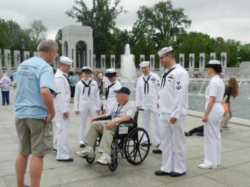 One of the Maine veterans on the trip finds a group of Navy personnel to talk to. (Photo by Eva Murray)