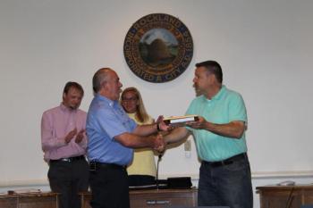Lt. Dennis Camber, of Rockland Fire and EMS, was recognized by the Rockland city council for 20 years of service. The picture shows Lieutenant Camber receiving a plaque and shaking hands with Rockland Mayor Frank Isganitis. (Photo courtesy Alan Athearn/ Rockland Fire and EMS)