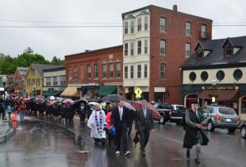 Under a light mist, the seniors of the Camden Hills Regional High School Class of 2015 made their way through downtown Camden and then up to the Congregational Church for baccalaureate. (Photo by Lynda Clancy)