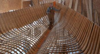 Kenny Dodge, in the hull of his new boat, made from oak cut and milled on his Rockport land. (Photo by Lynda Clancy)
