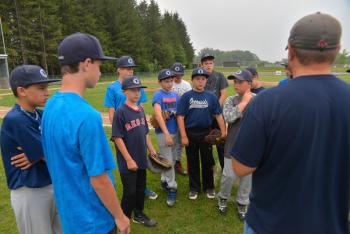 Coach has the boys attention. (Photo by Ron Hawkes)