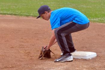 Vinalhaven’s Tim Farrelly works the drill from first base. (Photo by Ron Hawkes)