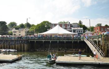 Castine’s public landing is filled with cheering admirers. (Photo by Lynda Clancy)