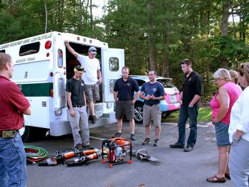 Members of the Lincolnville Board of Selectmen get a look at the new Holmatra extrication equipment that Lincolnville Volunteer Fire Department Inc. gifted to the town Monday night. (Photo by Holly S. Edwards)