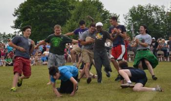 It is all action as the tumble for the cheese wheel begins. (Photo by Lynda Clancy)