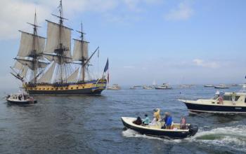 Sailing up Penobscot Bay, L’Hermione towered above her American friends in a flotilla of history and bonhomie. (Photo by Lynda Clancy)