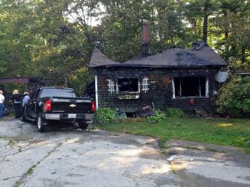 Investigators with the Maine Fire Marshal’s Office remain Sunday morning at 2 Virginia Drive in Lincolnville. (Courtesy Camden Fire Department)