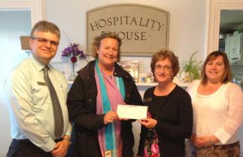 Employees from Camden National’s Rockland branch present proceeds from the bank’s Hope@Home program to Stephanie Primm, executive director of Hospitality House. (Pictured L-R) – Randy Cruz, branch manager; Primm; Jane Merrill, senior retail loan officer; and April Murray, assistant branch manager.