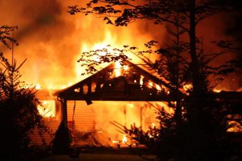 An early morning fire on Payson Road in Union destroyed a home, an attached garage and vehicles Tuesday. (Photo by Holly S. Edwards)