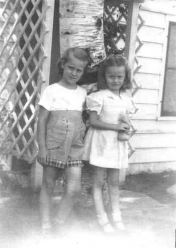 Here we are, Linda and I. What was my mother thinking? Socks and Mary Janes in the woods of Wisconsin?
Photo courtesy Diane O’Brien sharps resort