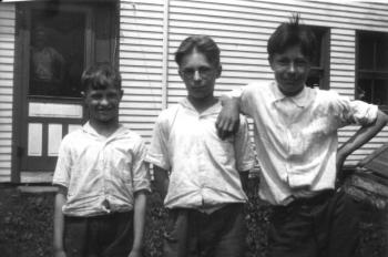The three Young brothers – Clyde, Bradford and Albert – grew up on the Youngtown Road farm that stood where the Cellardoor Winery is today. Clyde, who never married, filled the role often played by the youngest son in a farming family: he stayed and took care of his mother as she aged. His niece, Ruth Spandonis, speculates that the little cabin he built on the mountain across from the farm was his refuge.
Photo from Lincolnville Historical Society young brothers