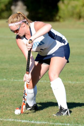 Oceanside’s Alexis Mazurek settles a ball off a penalty corner. (Photo by Ron Hawkes)