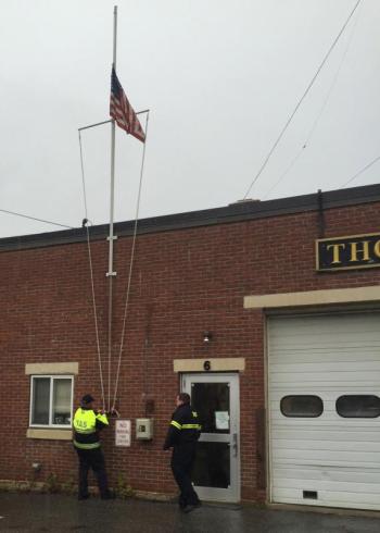 In Thomaston, the flag is raised at 8:40 a.m. (Photo by Lynda Clancy)