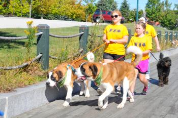 The walk along the Rockland Boardwalk was part of the one-mile dog walk. (Photo by Ron Hawkes)