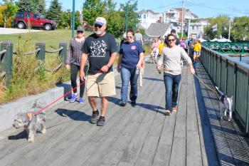 The walk along the Rockland Boardwalk was part of the one-mile dog walk. (Photo by Ron Hawkes)
