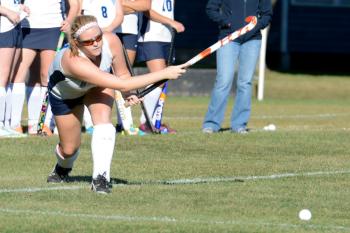 Oceanside’s Alexis Mazurek gives the ball a ride from the sideline into the circle. (Photo by Ron Hawkes)