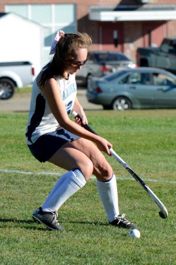 Oceanside’s Clara Feltus tracks down a loose ball after a long sprint to the corner. (Photo by Ron Hawkes)