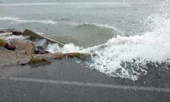 Wind-whipped waves at high tide breach Route 1 at Lincolnville Beach Thursday at the 12:40 p.m. high tide. (Courtesy Nanette Gionfriddo)