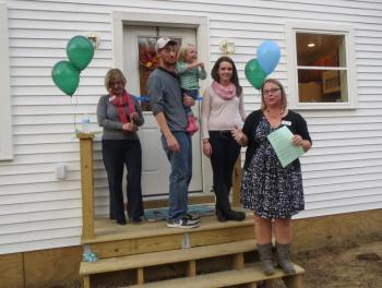 The family is joined by Mandie Sawyer. (photo by Erica Thoms)