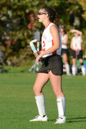 Camden Hills Hilary Merrifield watches as Winslow plays a corner. (Photo by Ron Hawkes)