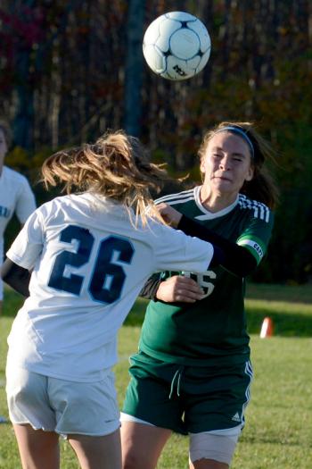 Oceanside’s Gabby Straka, (26), heads the ball before Mount View’s Ryleigh Lord could get to it. (Photo by Ron Hawkes)