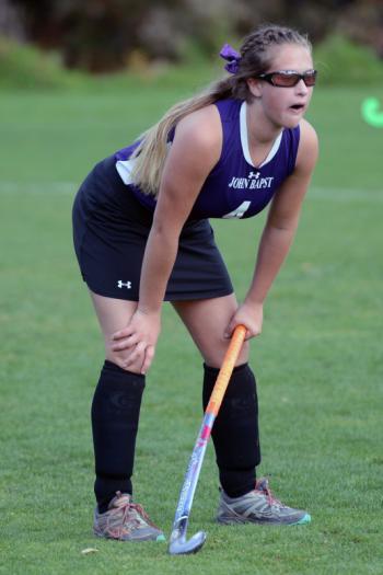 A scary moment made laughable. John Bapst’s Megan Tribuzio took the ball on a very hard hit squarely in the throat. She gasped for air, turned to go to her position and upon setting herself up proclaimed loudly, “I’m OK lets go!” Cheers and applause was the response. (Photo by Ron Hawkes)