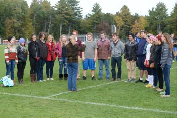 The Camden Hills Choir, led by Kim Murphy, sings the National Anthem. (Photo by Ron Hawkes)