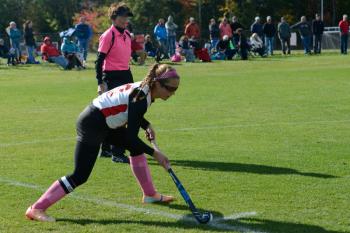 Camden’s Emily Daggett delivers a penalty corner stroke to her teammates. (Photo by Ron Hawkes)