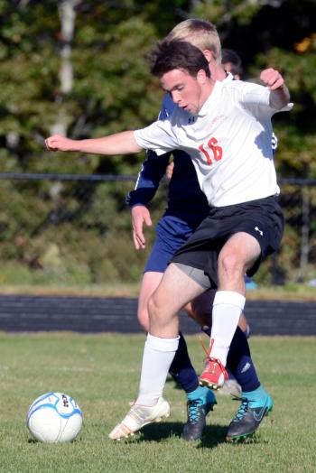 Camden’s Kieran Lydon uses his whole body to corral the ball and block out a Mt. Blue defender. All photos from the Camden Hills Homecoming held Saturday, Oct. 10. (Photo by Ron Hawkes)