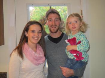 Lizzie Bilzier, Nick Thibodeau and their daughter, Lily.