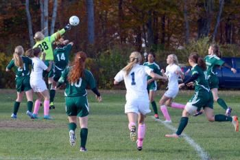 Mount View’s Jenni Nadeau (88) got up in front of Oceanside’s Cassidy Boynton (4) and punches this ball out off a corner kick. Nadeau stopped 19 shots to get the Mustangs the tie. (Photo by Ron Hawkes)