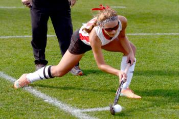 Camden Hills Emily Daggett delivers the ball on a penalty corner against No. 9 John Bapst. The Windjammers won 4-0 and advance to the quarterfinals. (Photo by Ron Hawkes)