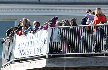 Watching for Santa Claus to arrive in his helicopter Sunday, from the deck of the Maine Lighthouse Museum. (Photo by Holly S. Edwards)