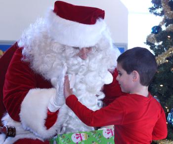 It’s not very often you get to hi-five with Santa Claus. (Photo by Holly S. Edwards)