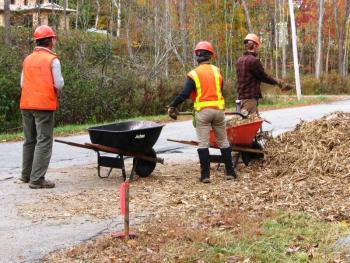 Loading erosion mulch. (Photo Courtesy of Karen Brace)