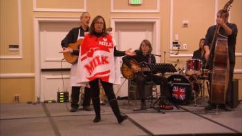 Penobscot Bay Pilot Editorial Director Lynda Clancy pretends to be a carton of milk in The After Hours Kitchen Cabaret, an original musical spoof written, directed and performed by John Burstein, a member of the Campaign Committee. Burstein accompanies Clancy, along with guitarist Phil Clement, at the kickoff for the MCH-Meals On Wheels Kitchen Appeal, a campaign to build a new kitchen to double the number of meals produced each week for home-bound seniors and people with special needs. Seventy-five volunteers deliver 125 home-cooked meals a day in Knox County, but as the populace of Mid-coast Maine continues to age, requests for meals have increased a dramatic 25%.