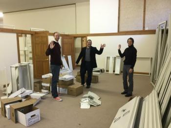 Waving from the children’s room of the new temporary library, L to R are, Ben Odgren, Ben Blackmon and Kim Slocomb. (Photo Courtesy of Amy Filley)
