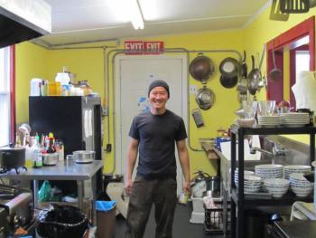 Pho Sizzle owner Tom Pham in his new working space on Leland Street in Rockland. (Photo by Kay Stephens)