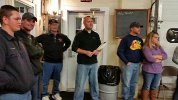 Rockport Firechief Jason Peasley has his paddle ready to make a bid at the live auction. (Photo by Sarah Shepherd)