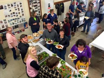 The volunteers were busy keeping the dinner line moving along. (Photo by William Smith)