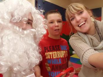 We finally got Isaac Richardson to take a picture with Santa by having him take a selfie with us J