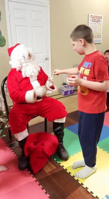 Isaac Richardson, was very interested in Santa, but would only do really quick “drive-bys”.
