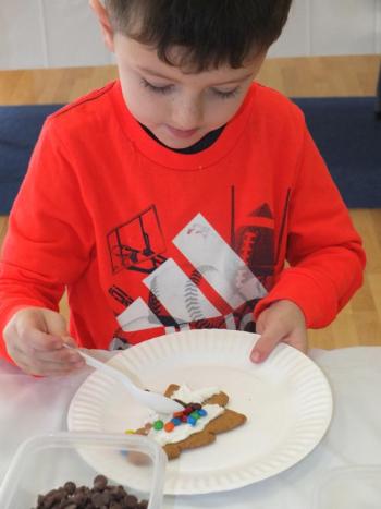 Hunter Harris decorates a cookie at Pen Bay Area YMCA. (Photos by Chris Wolf)