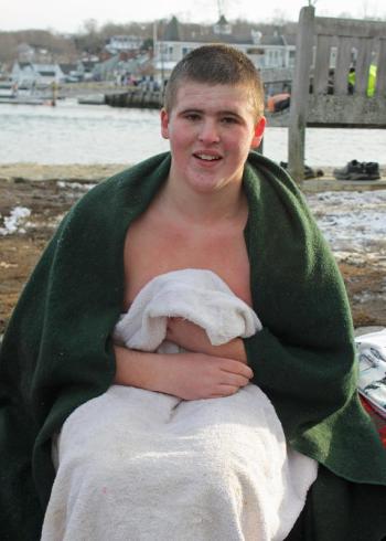 Jason Reese of Rockland warms up after his polar plunge in Camden Harbor to benefit Coastal Mountains Land Trust. (Photo by Holly S. Edwards)