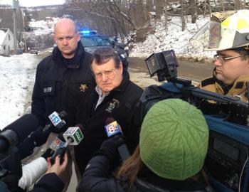 Knox County Sheriff’s Chief Deputy Tim Carroll, Sgt. Joel Davis, and Union Asst. Fire Chief Jesse Thompson talk to the press at 9 a.m., Jan. 14. (Photo by Lynda Clancy)
