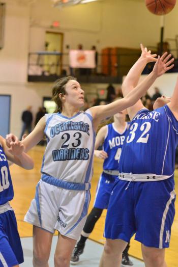 Oceanside’s Amelia Campbell reaches as far as she can for this rebound. (Photo by Ron Hawkes)
